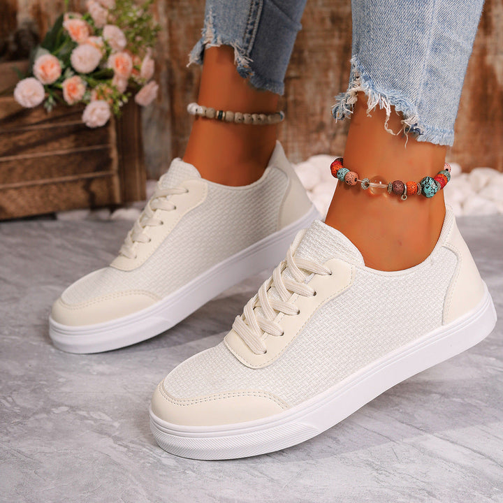 Sneakers da donna in mesh traspirante con elegante allacciatura e comoda suola ammortizzata, ideale per l'uso quotidiano.