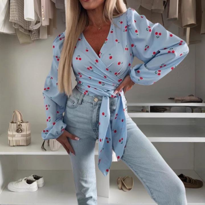 Top eleganti da donna con scollo a punta e polsini sulle spalle - tagli alla moda e stampe eleganti