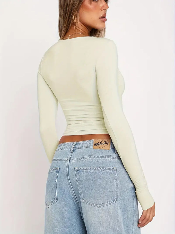 T-shirt da donna alla moda con scollo lungo e polsini eleganti