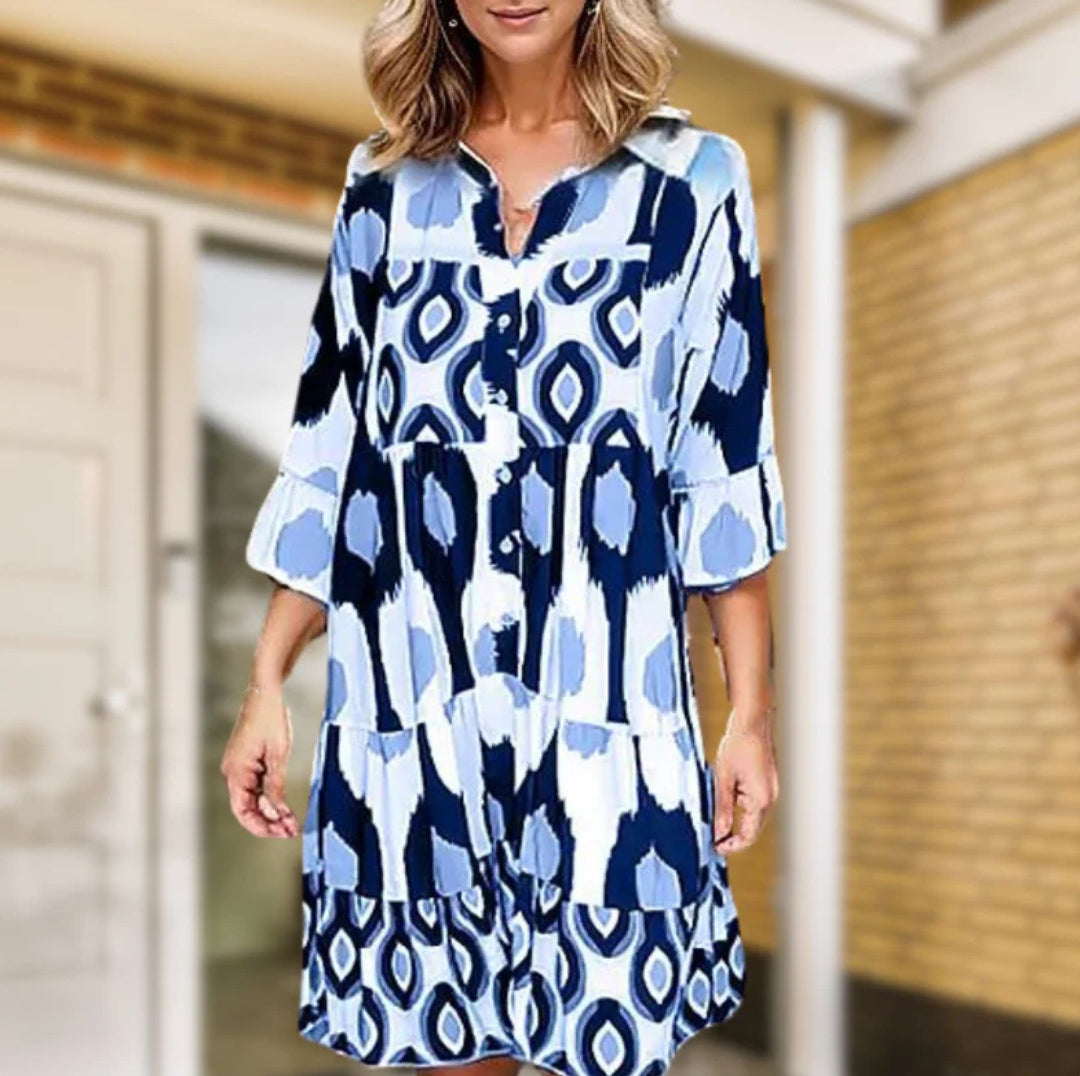 Elegante abito da donna con scollo a V e bottoni sul davanti - taglio casual con maniche di media lunghezza