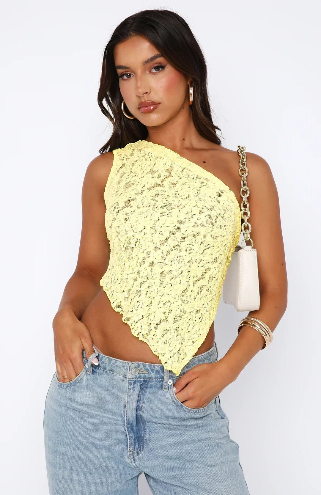 Elegante top monospalla da donna in pizzo con motivo floreale e fondo asimmetrico alla moda