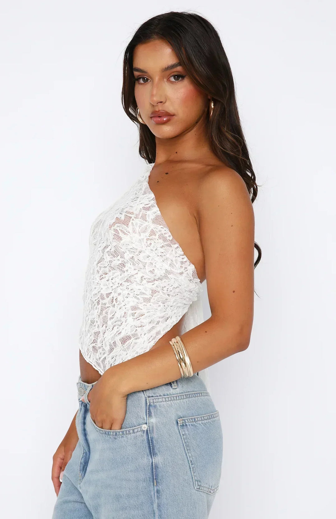 Elegante top monospalla da donna in pizzo con motivo floreale e fondo asimmetrico alla moda