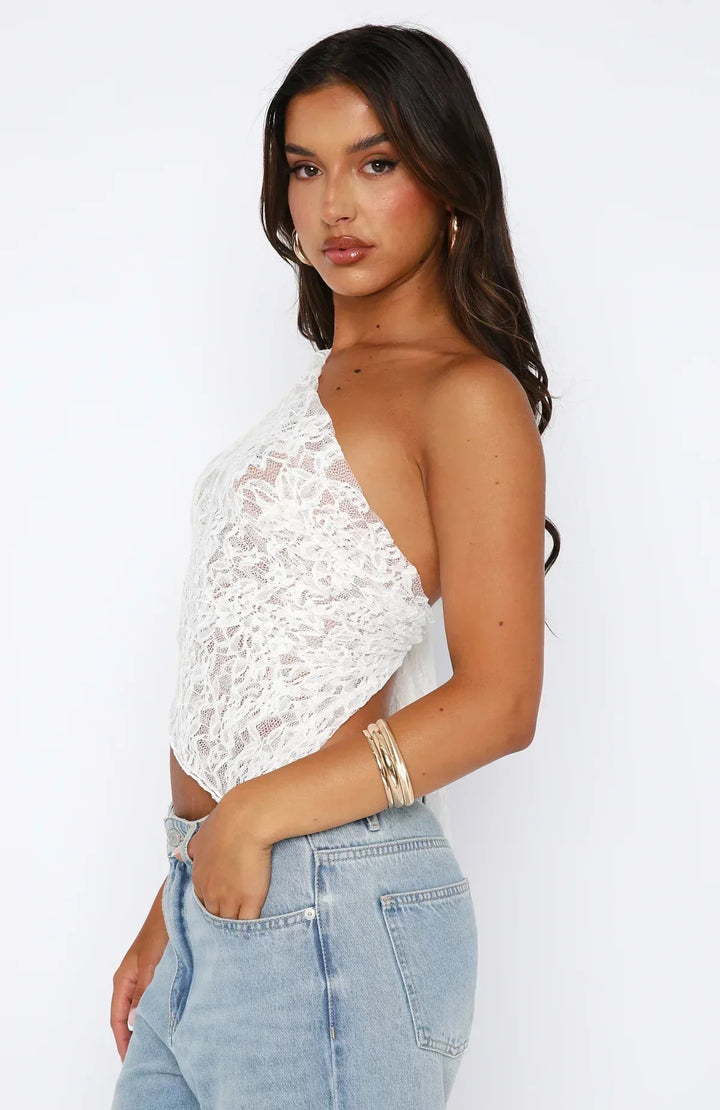 Elegante top monospalla da donna in pizzo con motivo floreale e fondo asimmetrico alla moda