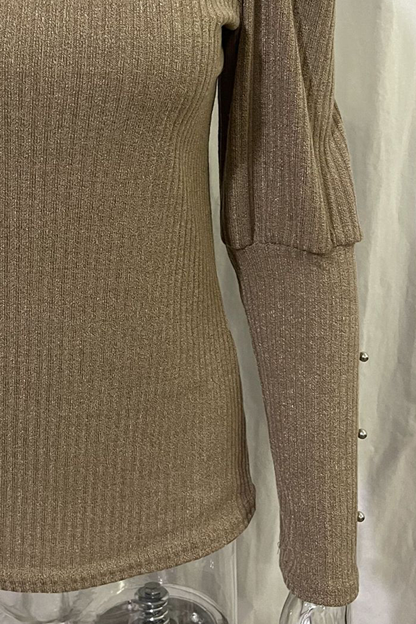 Top lunghi alla moda con colletto elegante per le donne