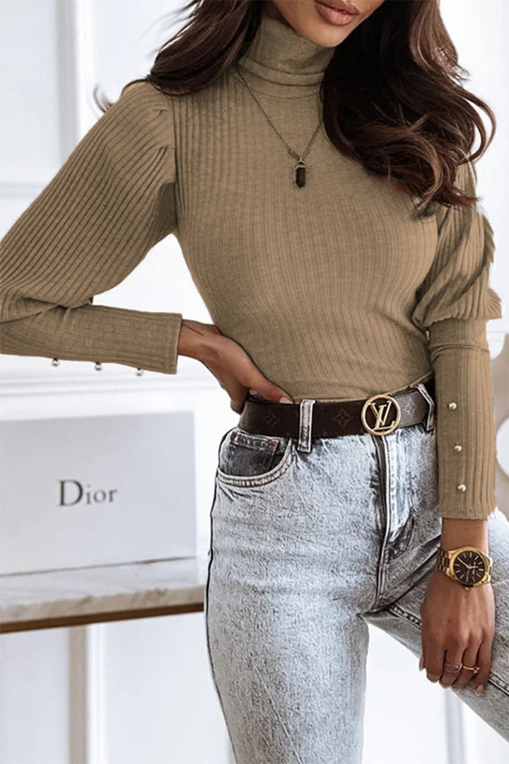 Top lunghi alla moda con colletto elegante per le donne