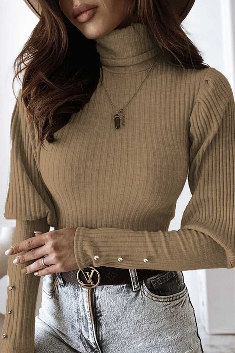 Top lunghi alla moda con colletto elegante per le donne
