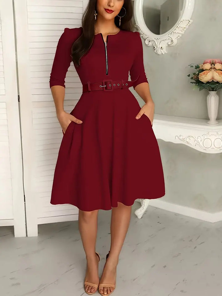 Elegante vestaglia da donna con polsini a tre pezzi, chiusura a zip, taglio aderente, lunghezza al ginocchio e tasche eleganti