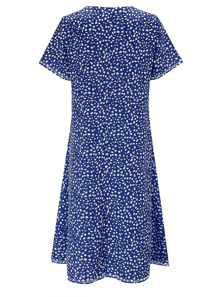 Elegante abito da donna al ginocchio con maniche corte, vestibilità ampia e scollatura arrotondata - un look casual comodo e leggero