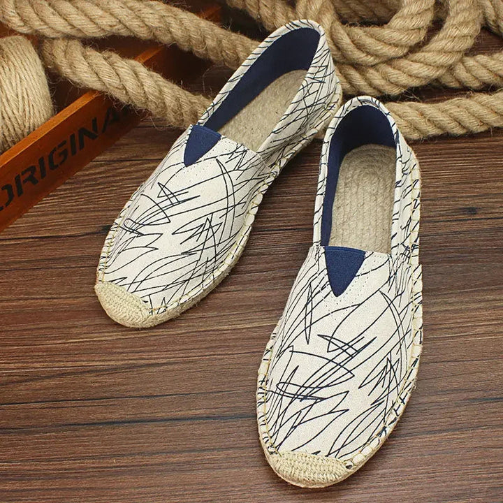 Scarpe moderne da uomo in tela slip-on con design traspirante e accenti graffiti