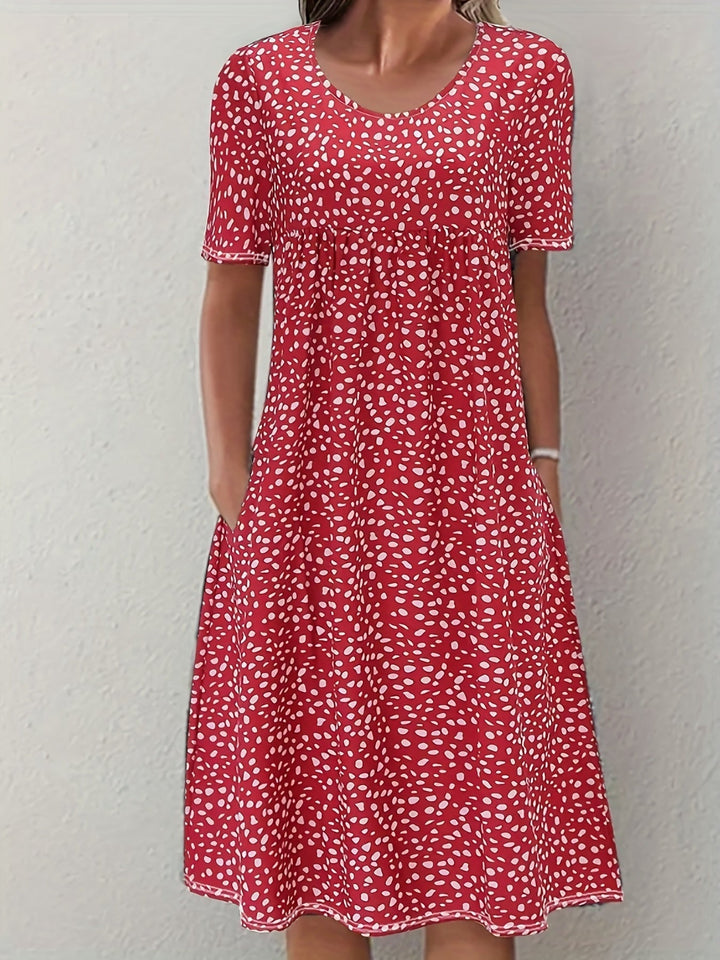Elegante abito da donna al ginocchio con maniche corte, vestibilità ampia e scollatura arrotondata - un look casual comodo e leggero