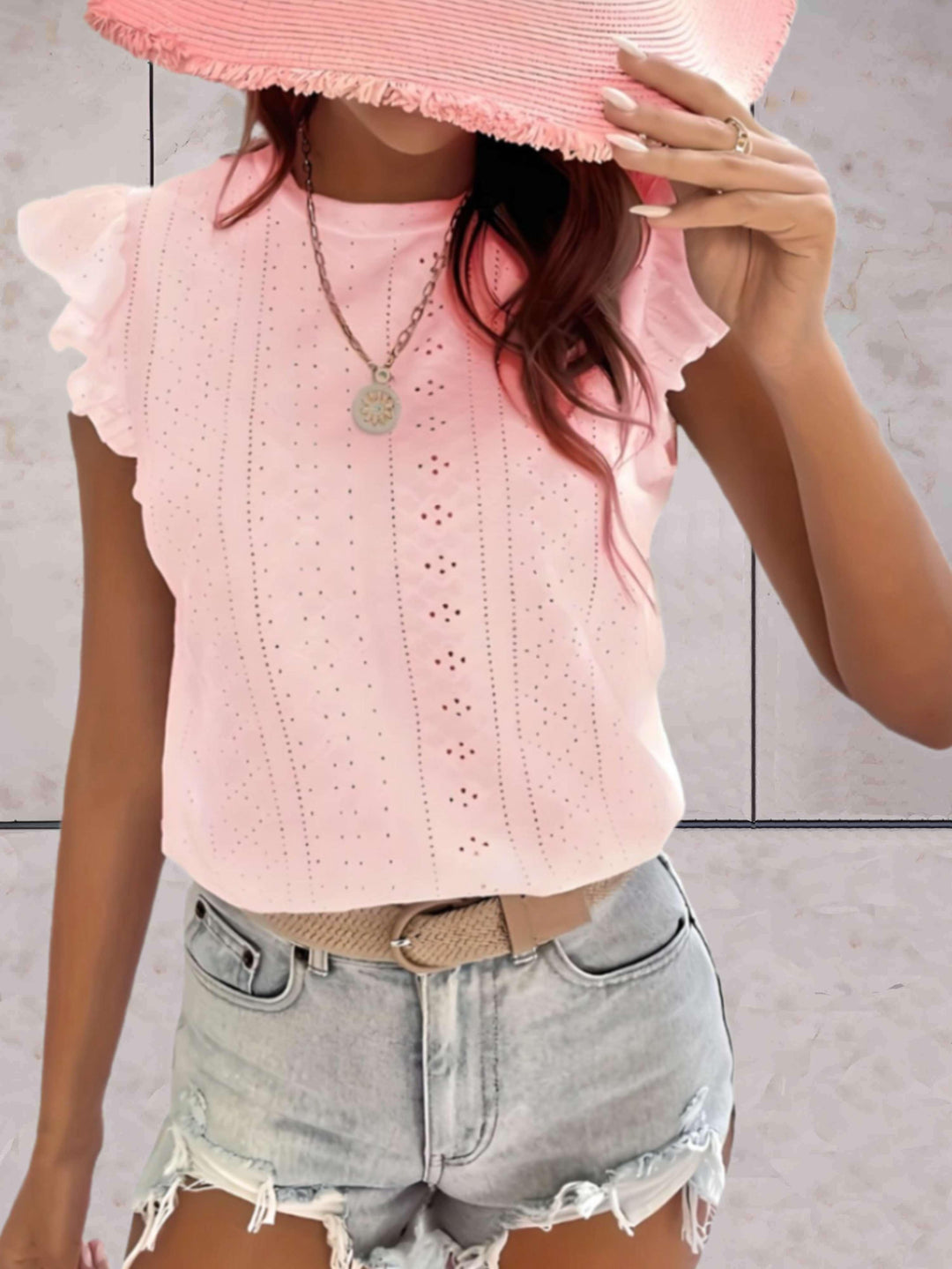 Elegante top voluminoso senza maniche da donna con una scollatura di grande effetto