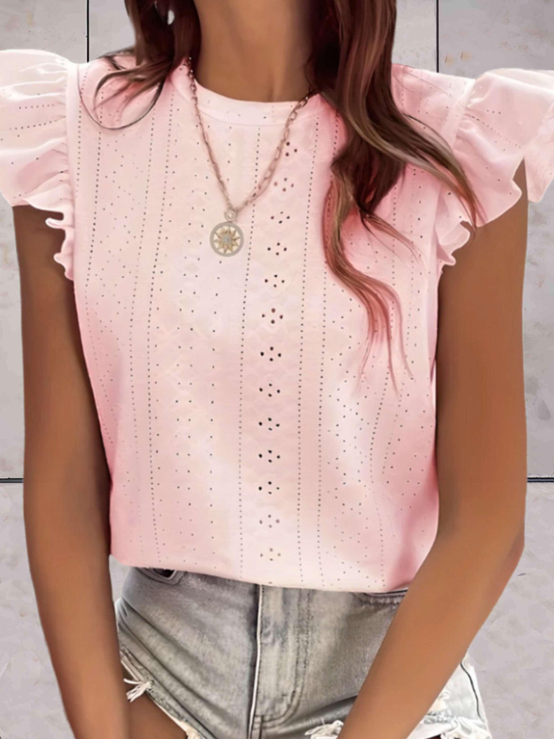Elegante top voluminoso senza maniche da donna con una scollatura di grande effetto