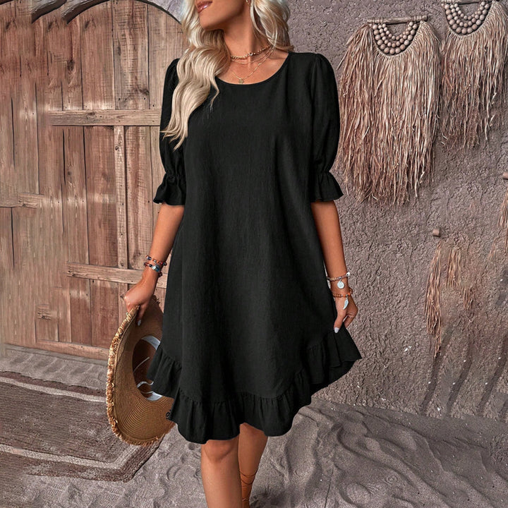 Robe femme élégante évasée avec manches bouffantes, col rond et ourlet volant pour un look chic et décontracté