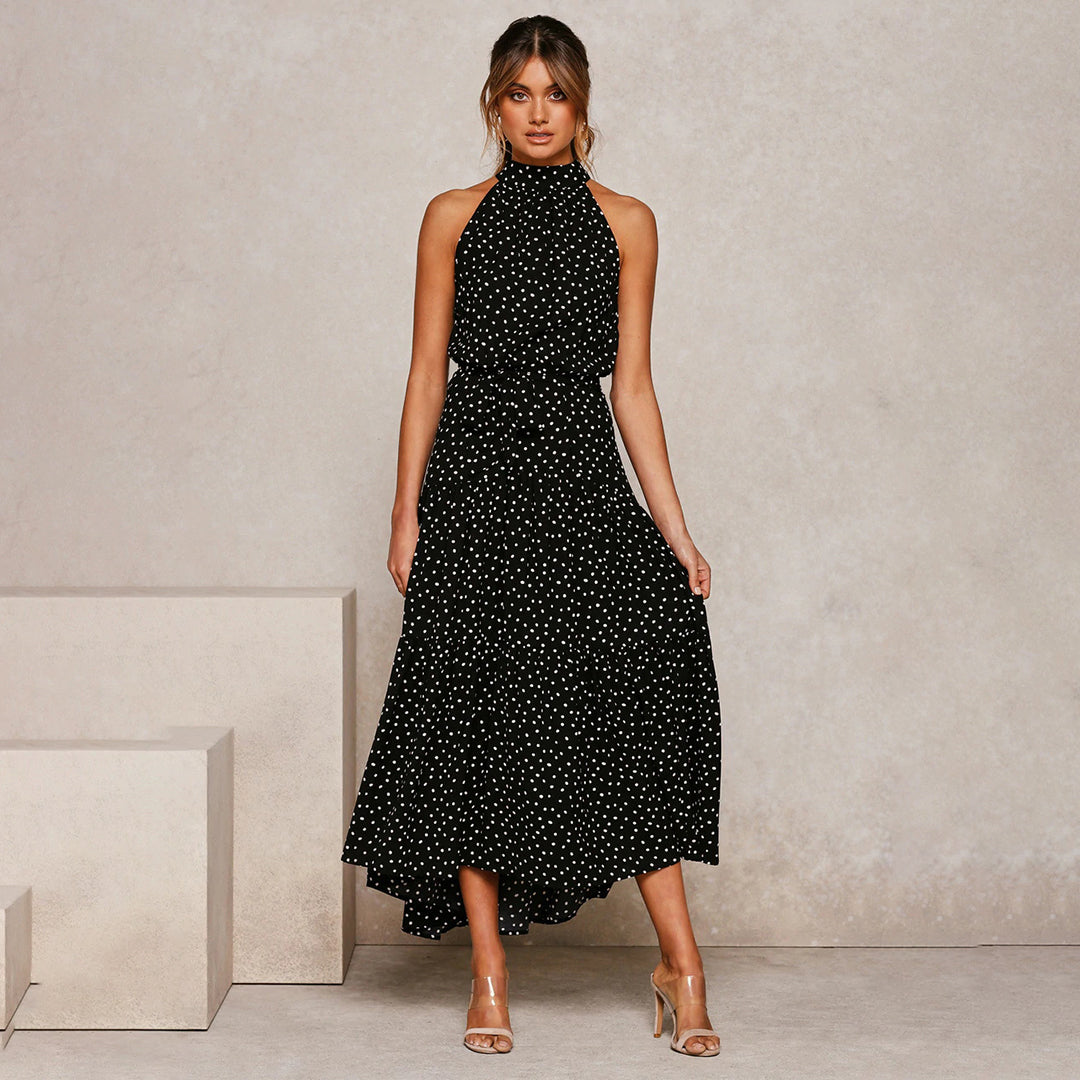 Elegante accappatoio da donna con collo a farfalla in fantasia pois, realizzato in morbido jersey con molte pratiche tasche e senza polsini