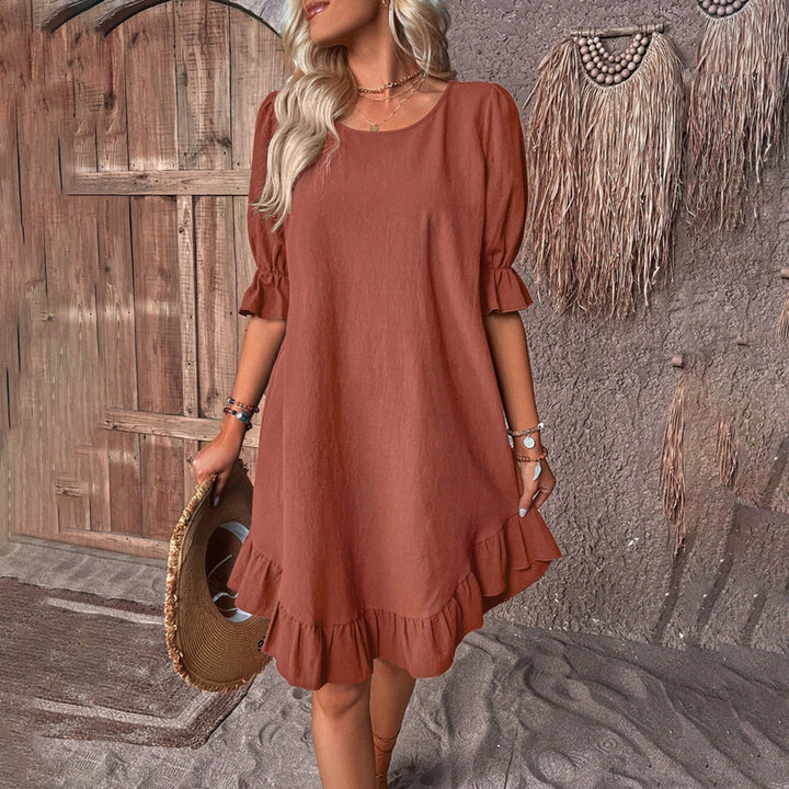 Robe femme élégante évasée avec manches bouffantes, col rond et ourlet volant pour un look chic et décontracté