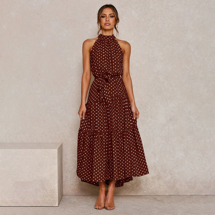 Elegante accappatoio da donna con collo a farfalla in fantasia pois, realizzato in morbido jersey con molte pratiche tasche e senza polsini