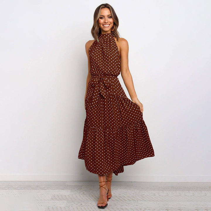 Elegante accappatoio da donna con collo a farfalla in fantasia pois, realizzato in morbido jersey con molte pratiche tasche e senza polsini