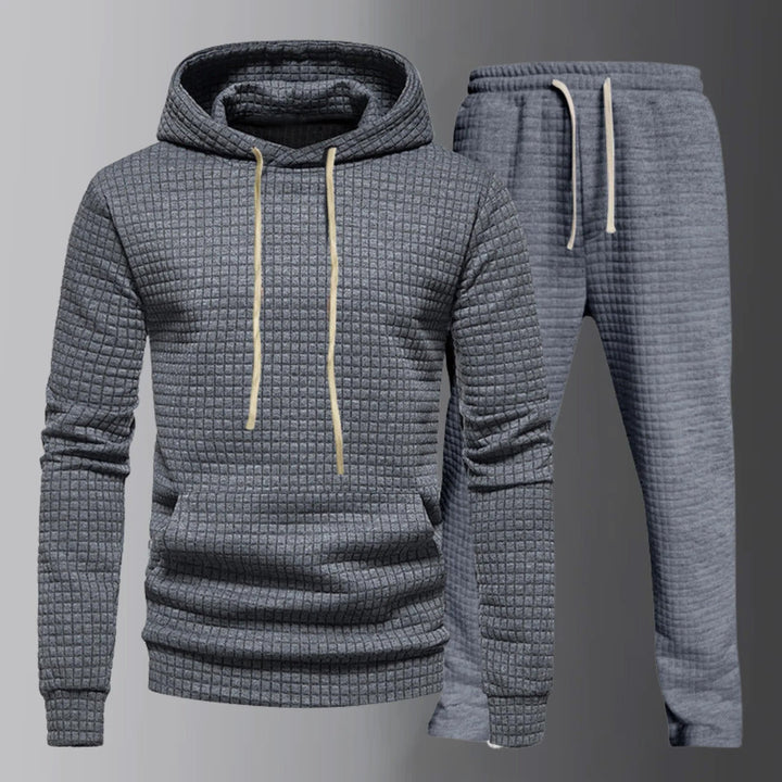 Set di eleganti felpe con cappuccio con coulisse regolabile e comodi pantaloni assorti da uomo