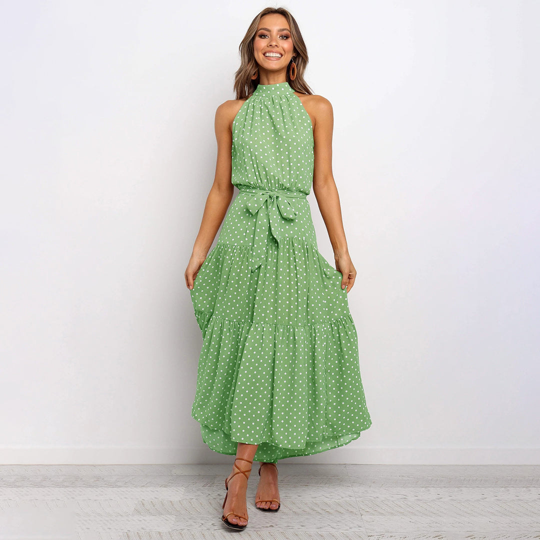 Elegante accappatoio da donna con collo a farfalla in fantasia pois, realizzato in morbido jersey con molte pratiche tasche e senza polsini