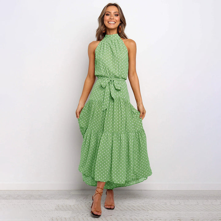 Elegante accappatoio da donna con collo a farfalla in fantasia pois, realizzato in morbido jersey con molte pratiche tasche e senza polsini