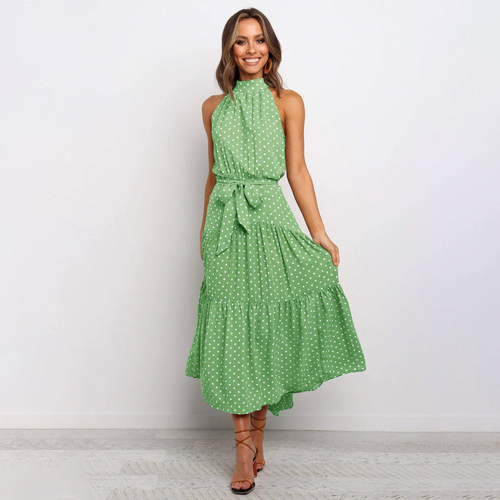 Elegante accappatoio da donna con collo a farfalla in fantasia pois, realizzato in morbido jersey con molte pratiche tasche e senza polsini