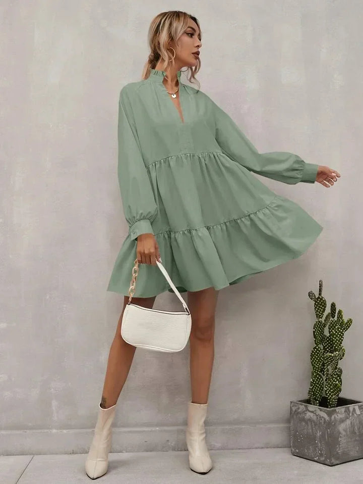Elegante gilet da donna dalla linea ad A con vistose pieghe, lunghezza regolabile ed elegante scollatura a V, con maniche lunghe aderenti - leggero e sofisticato