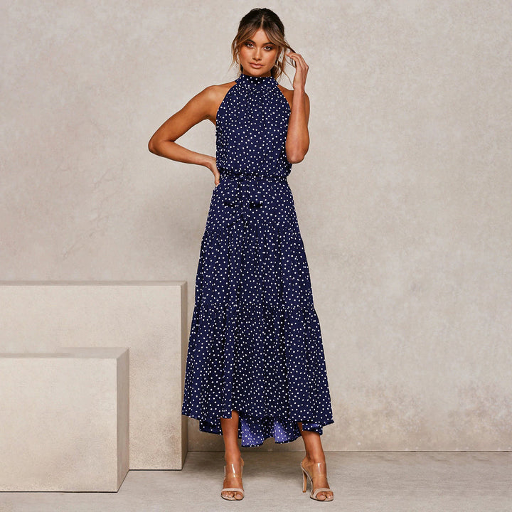 Elegante accappatoio da donna con collo a farfalla in fantasia pois, realizzato in morbido jersey con molte pratiche tasche e senza polsini