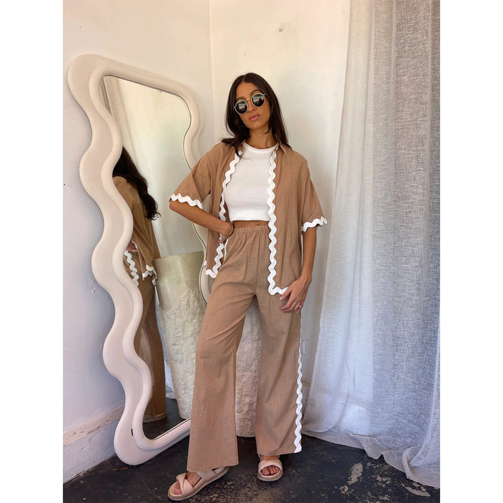 Elegante giacca-camicia da donna in cotone leggero e traspirante - vestibilità ariosa, elegante chiusura con bottoni a pressione sull'orlo e facile allacciatura anteriore