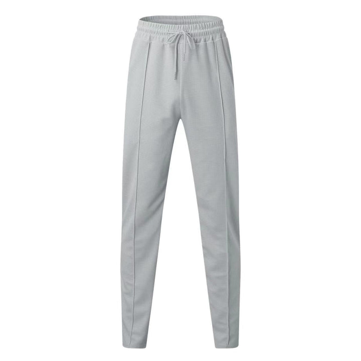 Elegante polo a maniche lunghe e comodi pantaloni da uomo