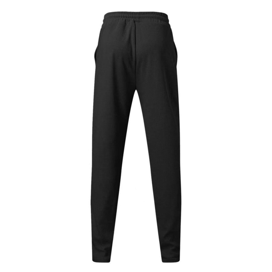 Elegante polo a maniche lunghe e comodi pantaloni da uomo