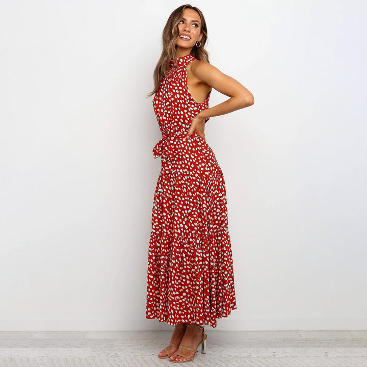 Elegante accappatoio da donna con collo a farfalla in fantasia pois, realizzato in morbido jersey con molte pratiche tasche e senza polsini