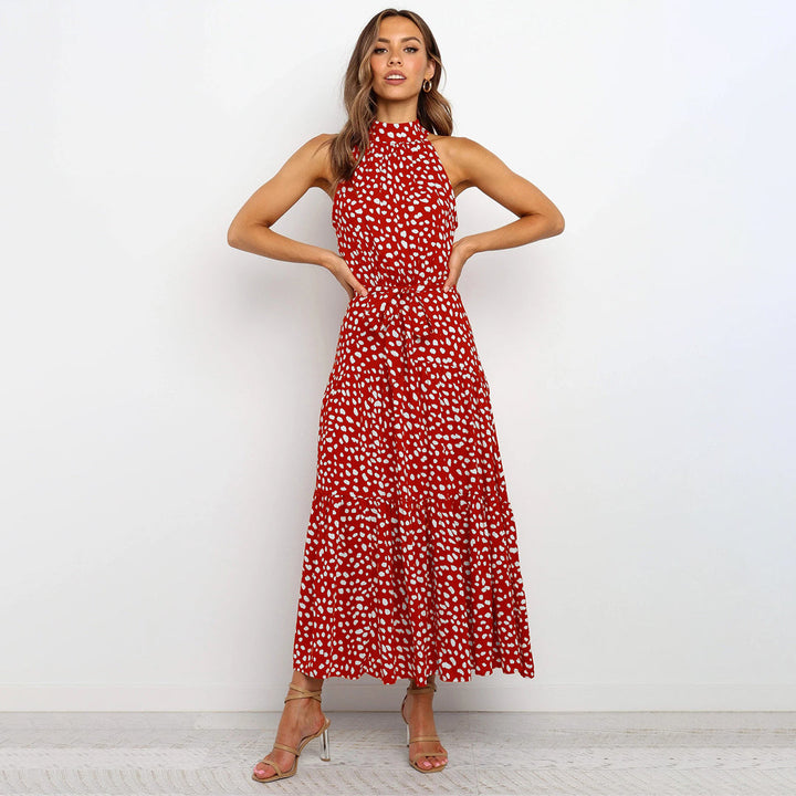 Elegante accappatoio da donna con collo a farfalla in fantasia pois, realizzato in morbido jersey con molte pratiche tasche e senza polsini