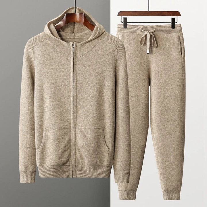 Kit da running da uomo in grigio elegante: pantaloni svasati alla moda, comoda maglia con zip e pantaloni comodi con coulisse e puntoni per il massimo comfort.