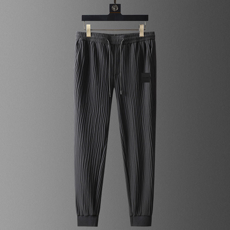 Elegante set tuta da uomo in tessuto plissettato - comoda T-shirt a maniche corte e comodi joggers dalla vestibilità rilassata