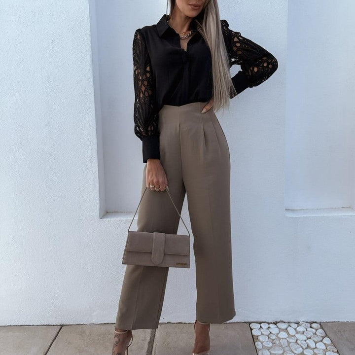 Elegante blusa da donna con maniche lunghe, accattivante scollatura profonda e dettaglio con bottoni - eleganza senza tempo