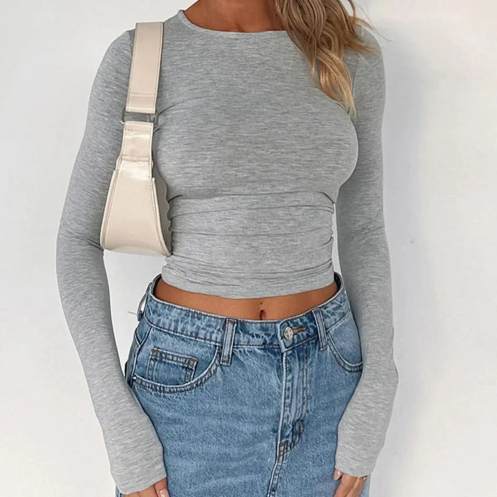 T-shirt da donna alla moda con scollo lungo e polsini eleganti