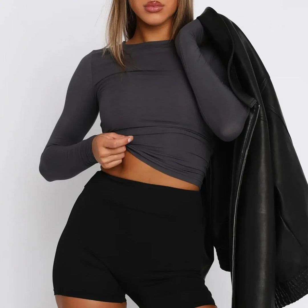 T-shirt da donna alla moda con scollo lungo e polsini eleganti