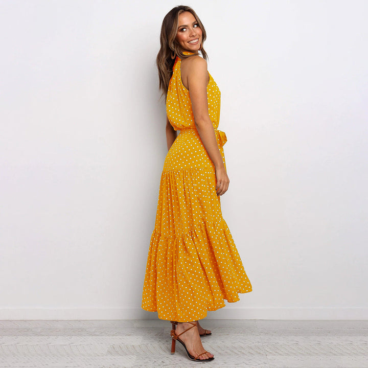 Elegante accappatoio da donna con collo a farfalla in fantasia pois, realizzato in morbido jersey con molte pratiche tasche e senza polsini