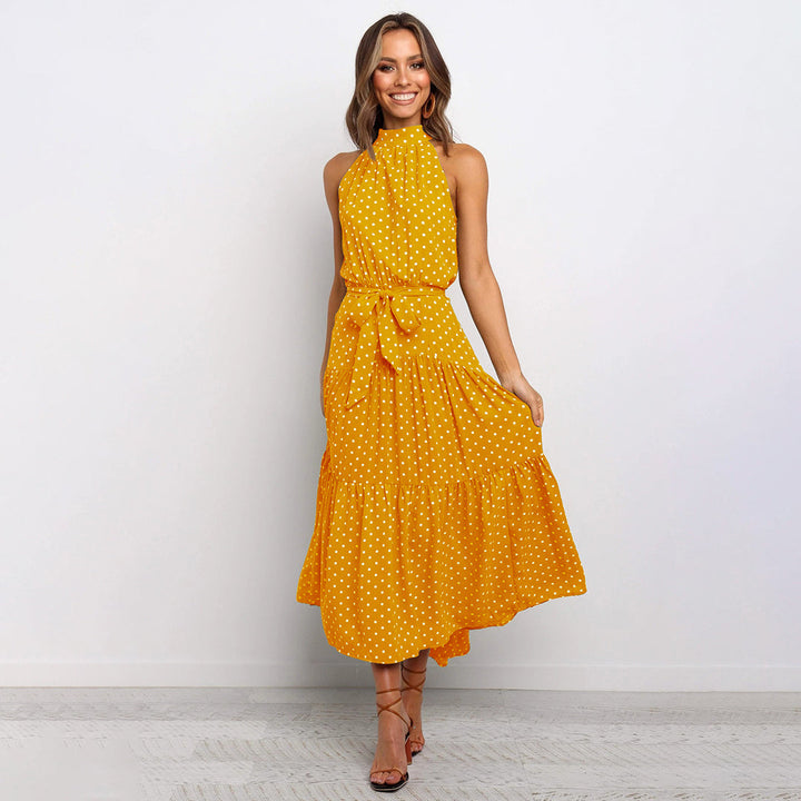 Elegante accappatoio da donna con collo a farfalla in fantasia pois, realizzato in morbido jersey con molte pratiche tasche e senza polsini