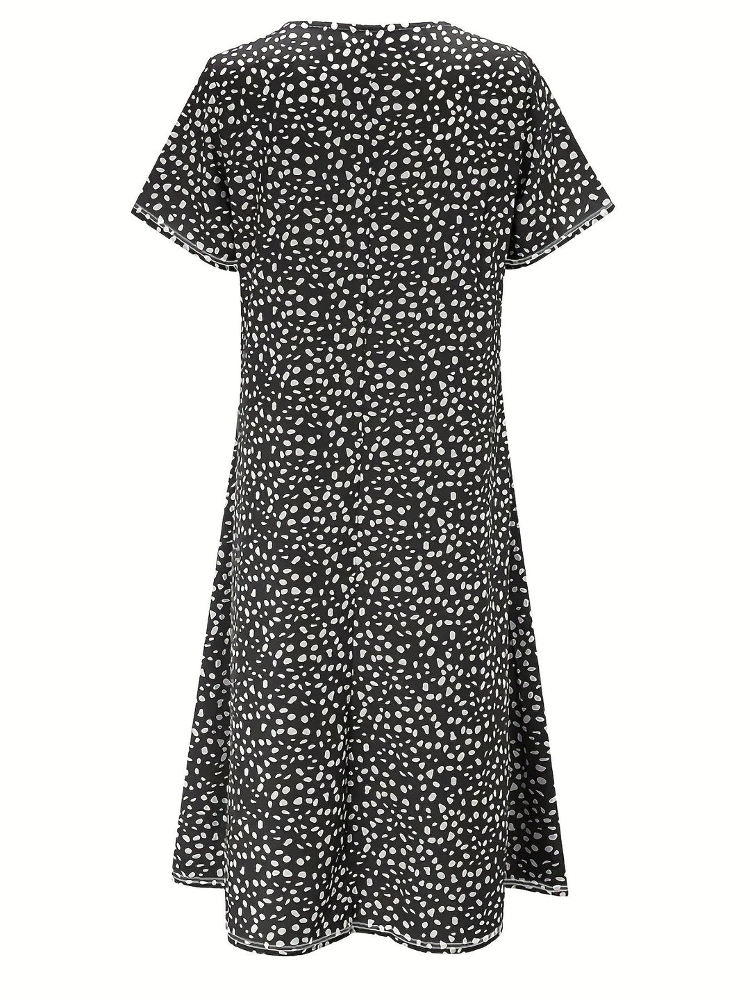 Elegante abito da donna al ginocchio con maniche corte, vestibilità ampia e scollatura arrotondata - un look casual comodo e leggero