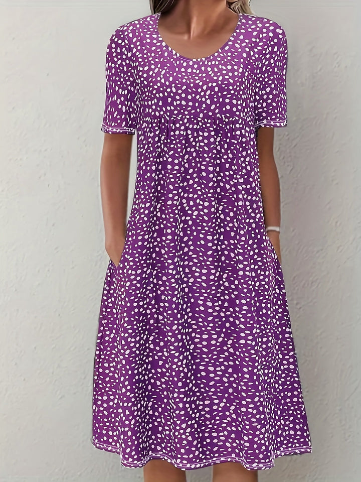 Elegante abito da donna al ginocchio con maniche corte, vestibilità ampia e scollatura arrotondata - un look casual comodo e leggero