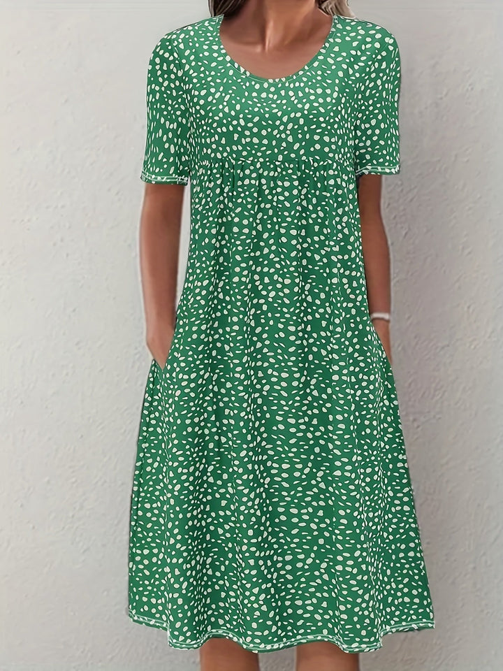 Elegante abito da donna al ginocchio con maniche corte, vestibilità ampia e scollatura arrotondata - un look casual comodo e leggero