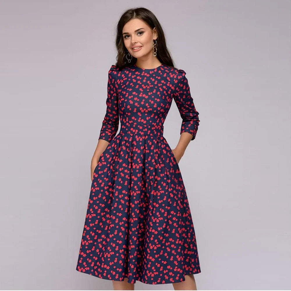 Elegante abito da donna con linea ad A e affascinante motivo floreale, lunghezza al ginocchio ed eleganti maniche a tre quarti